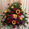 Mixed funeral spray 
sunflowers, carnations, snaps
As shown $125
starting at $110
plus delivery